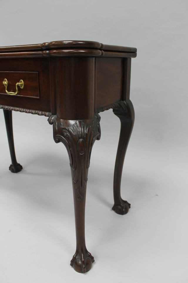 Here is a closer look at some of the mahogany table's carved features. 